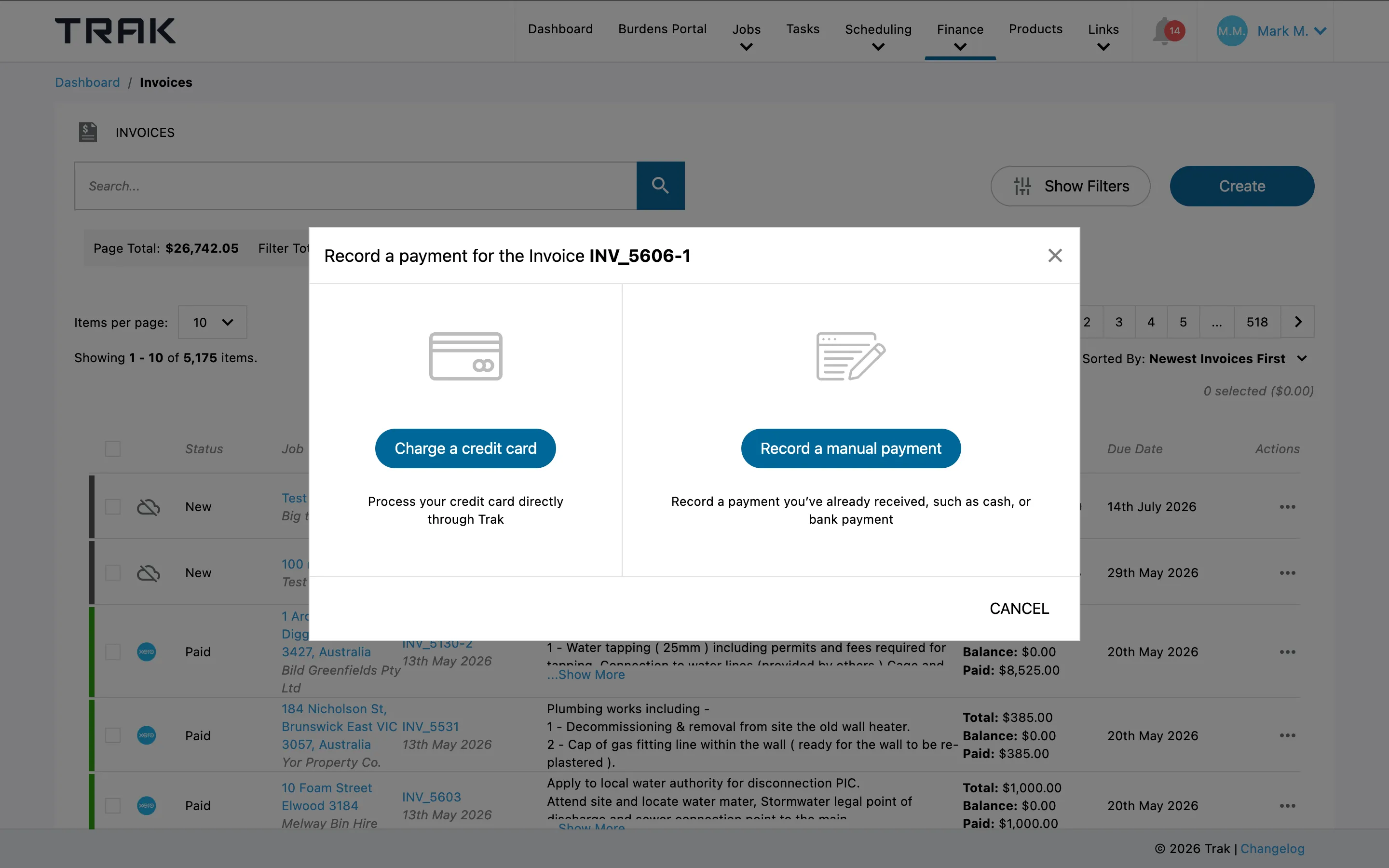 Recording a payment against an invoice in Trak, with the option to charge a card or record a manual payment